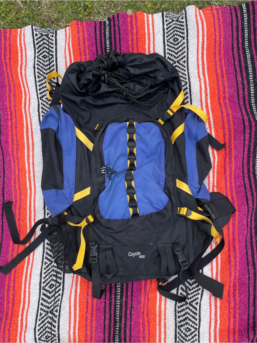 Kelty Coyote 4500 internal frame hiking backpack in blue and black with yellow